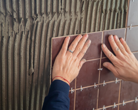 Polymer modified tile adhesive application for wall and floor tiles
